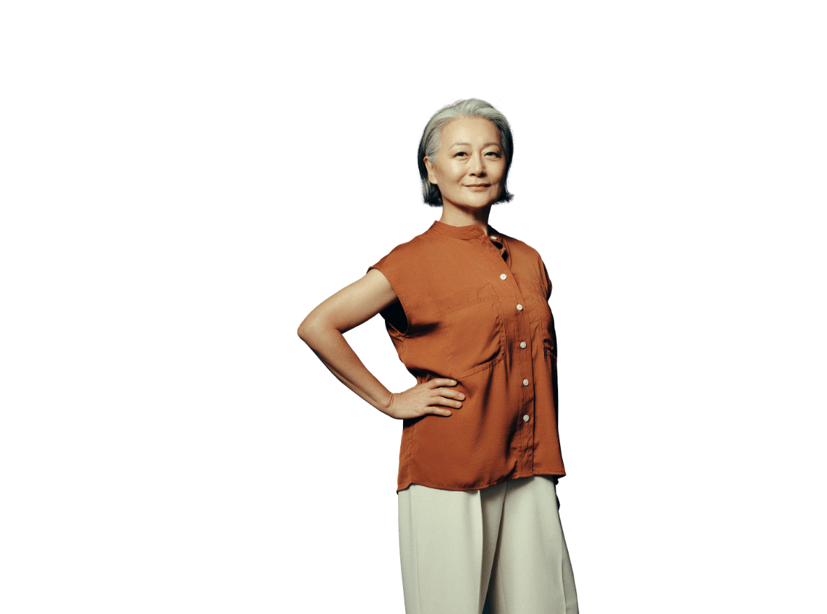 Middle-aged woman standing with her arm on her hip looking at you. Not actual patient